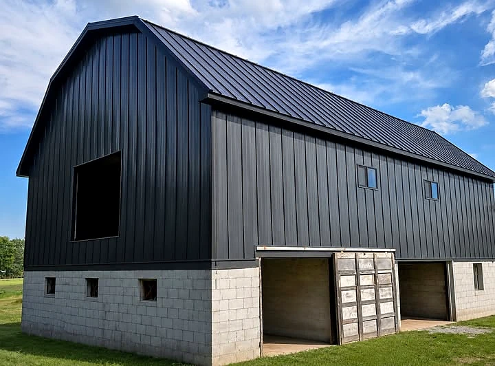 Michigan barn with new black metal roof and metal siding completed by Valor Roofing